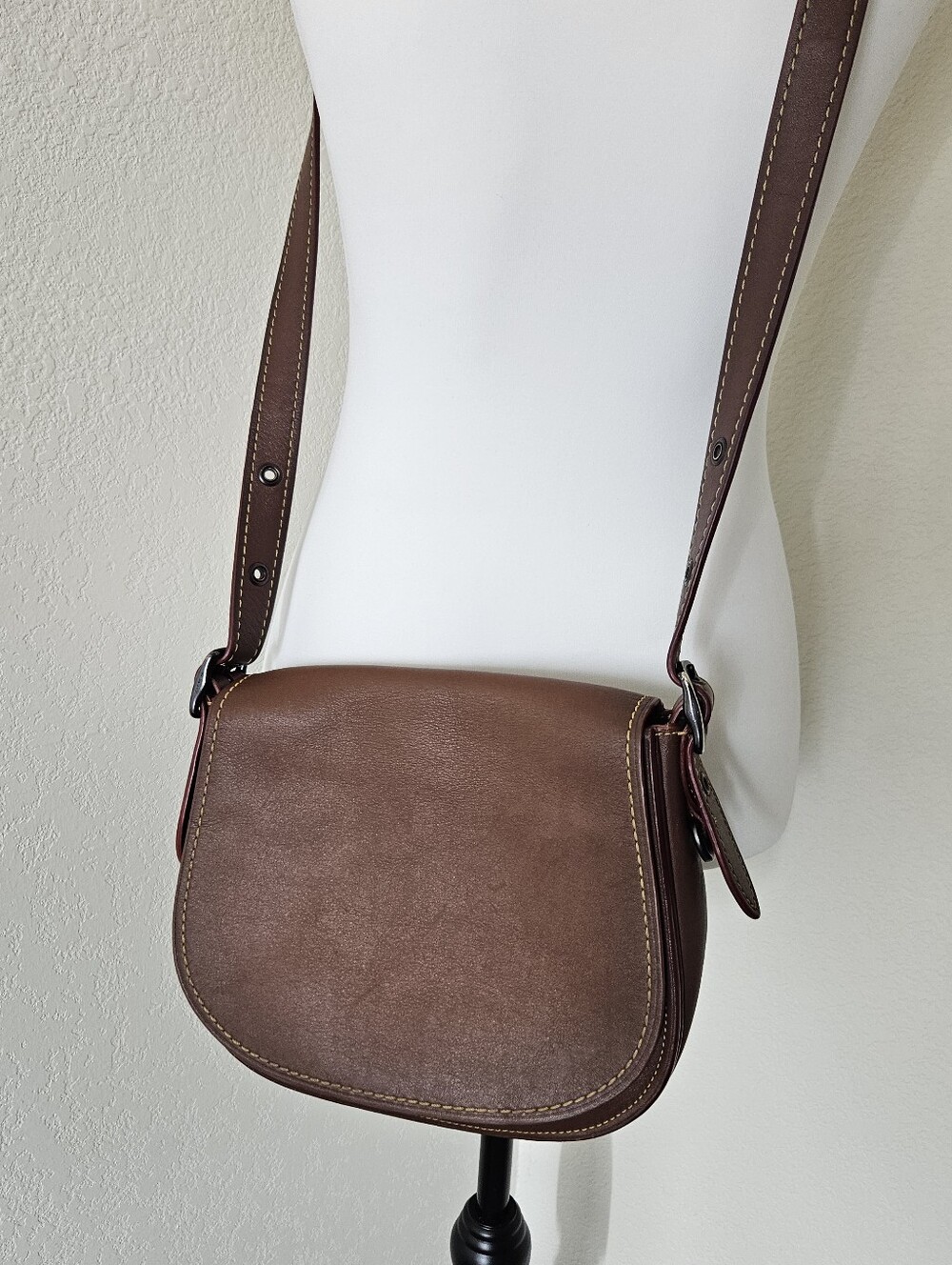 Coach 1941 Saddle Bag crafted from smooth brown leather with contrast stitching